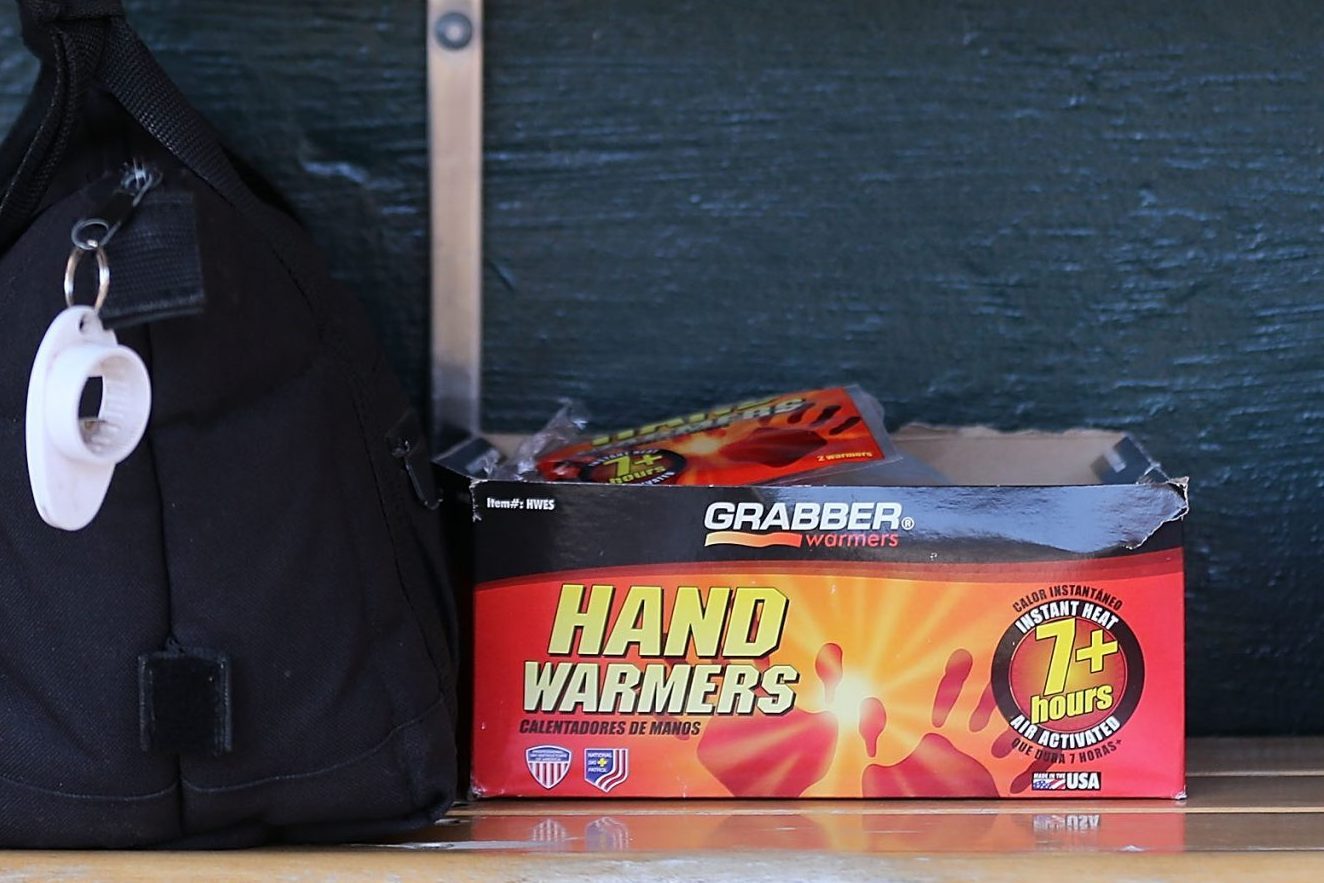 box of hand warmers on a bench