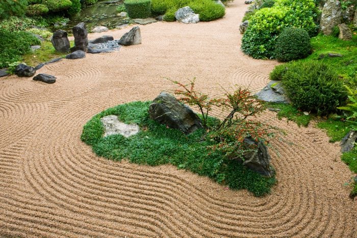 Japanese zen rock garden with sand