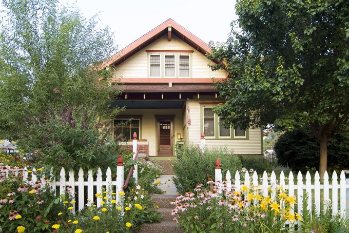 Bungalow House with White Picket Fence