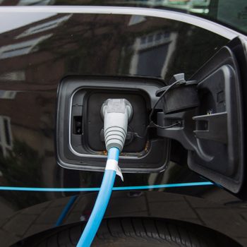Battery charger in the black electric car