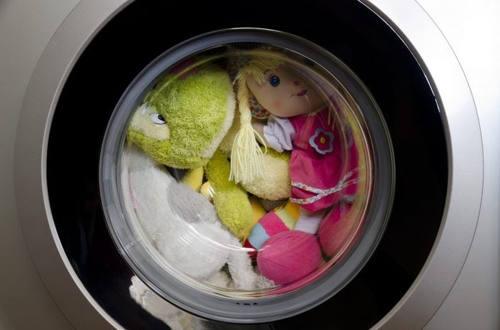 Washing machine door with rotating toys inside