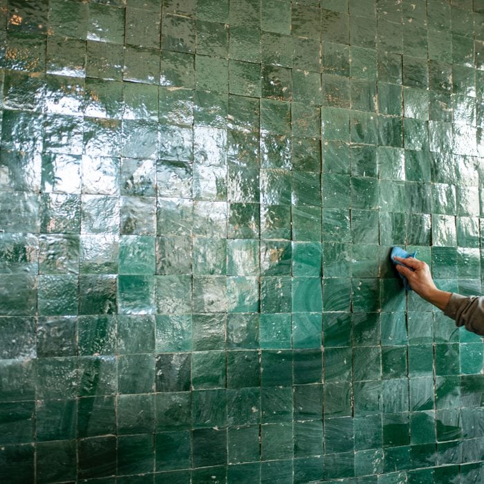 Moroccan Zellige Tiles Laying in a home interior by an unseen worker