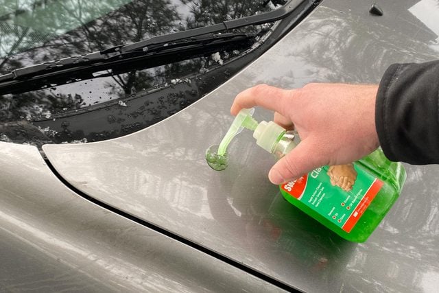  Apply green Cleaner from a pump bottle onto the car