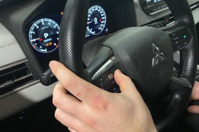 hand on steering wheel