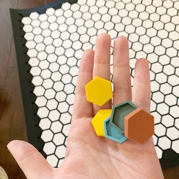 Tile Mat pieces in a hand
