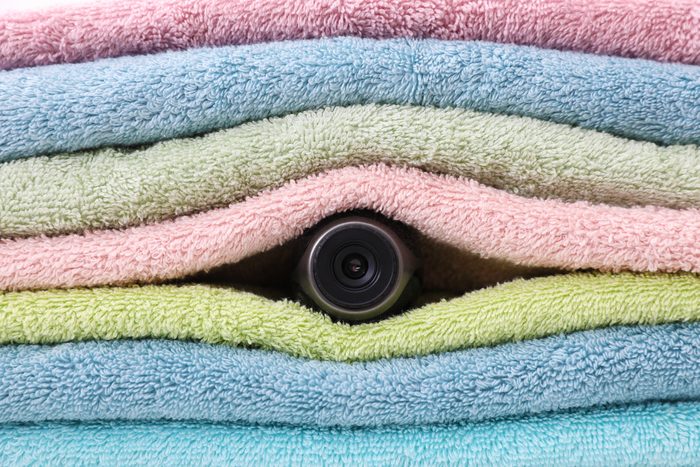 Camera hidden between folded towels, closeup view