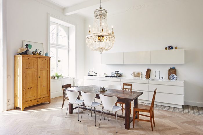 Modern kitchen with dining table in a refurbished old building