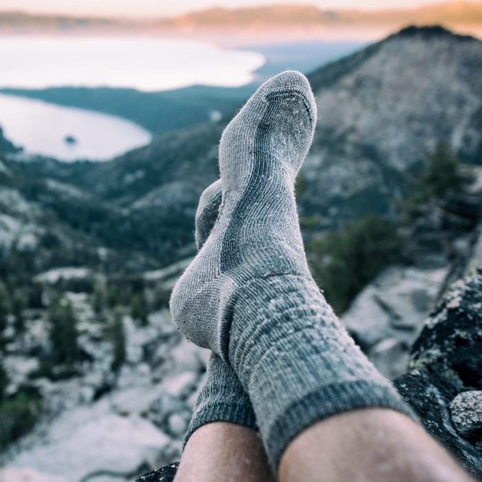 Resting in socks after a long hike in the mountains