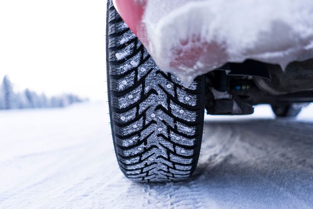 Close Up Of Snow Covered Tire in the winter season