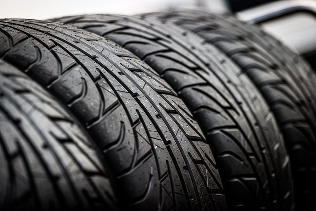 Wet Michelin Tires Sit on a Rack of the Spa World Endurance Championship Race