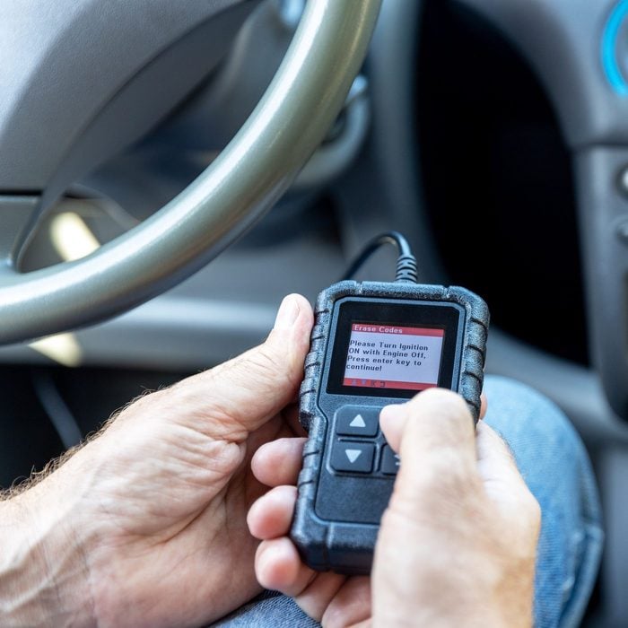 Using a car scan code reader for repair diagnostic and check engine test