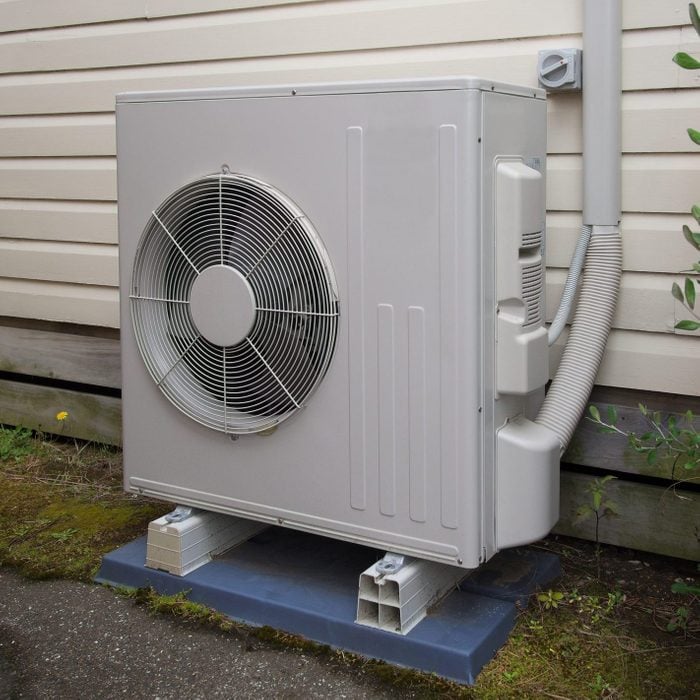 Air conditioning and heating unit for a residential house