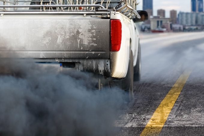 Air Pollution Crisis In City From Diesel Vehicle Exhaust Pipe On Road