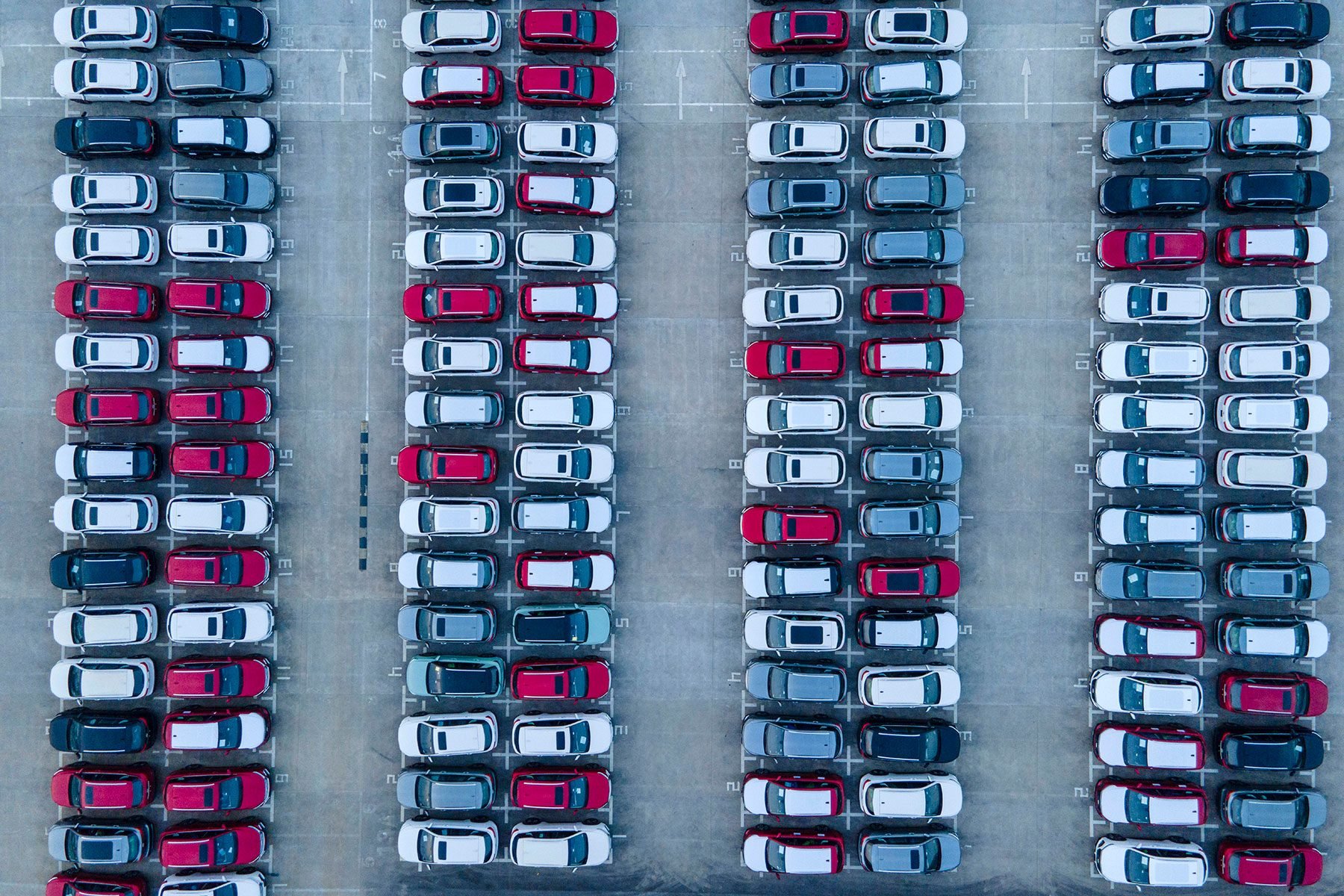 An aerial view of new cars at a parking lot in China due to the Chip Shortage