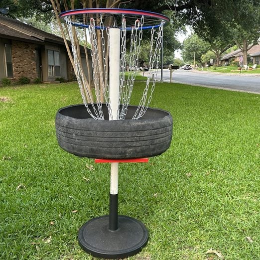 Disc Golf Finished Basket Grass Background