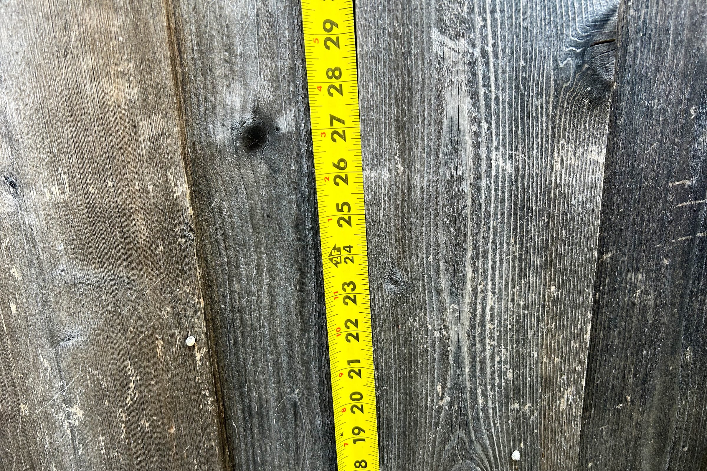 measuring the fence to make a dog window