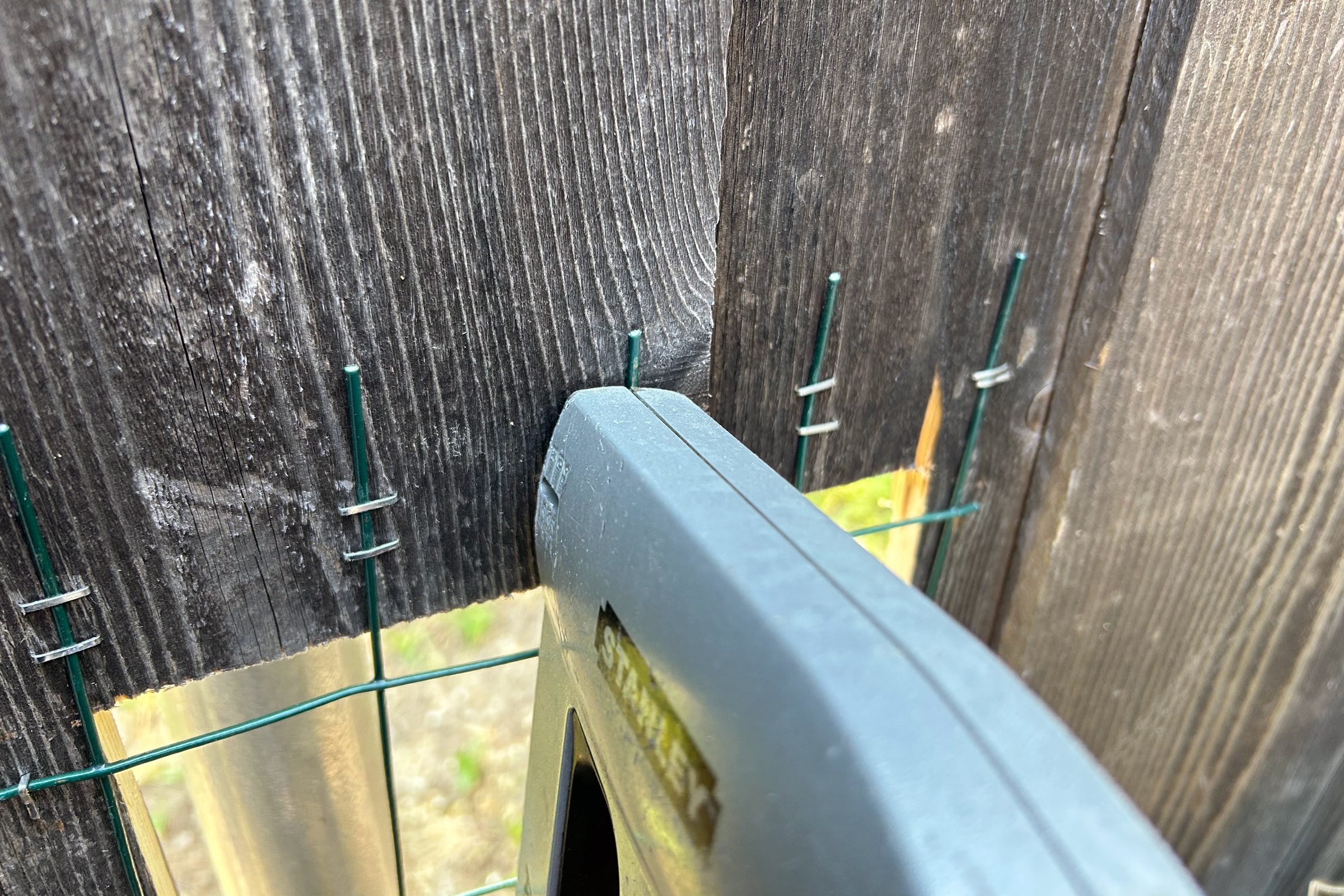 stapling chicken wire to fence