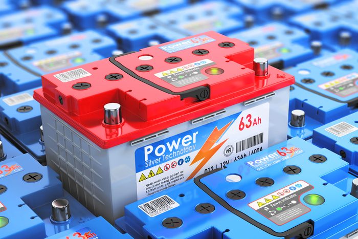 Car Battery Without Brand Surrounded By Other Batteries, 3d Illustration