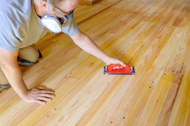 Sanding Wooden Floor with Hand Sander
