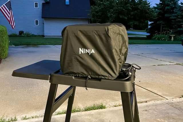 Ninja Woodfire Outdoor Oven covered with its cover