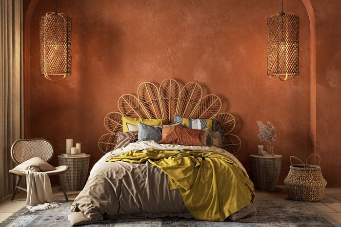 Rusty Red Orange Boho Style Interior With Armchair, Dresser And Decor