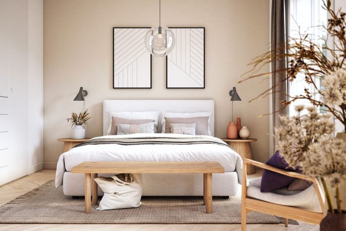 Warm Beige Scandinavian Bedroom Interior with wooden furniture, flowers, and artwork