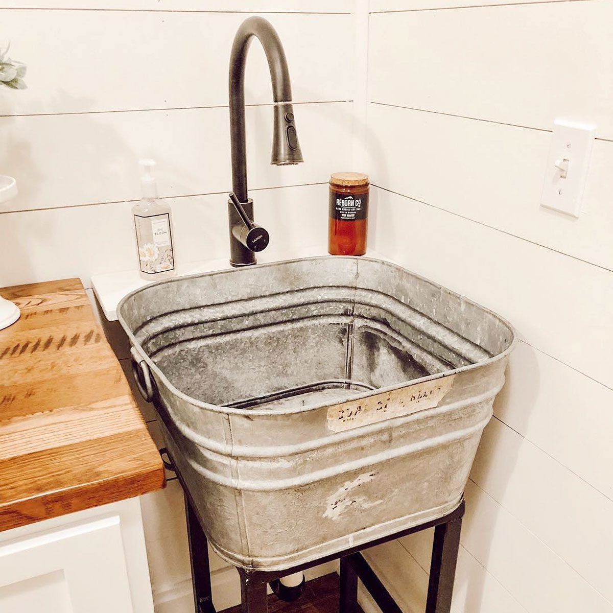 https://www.familyhandyman.com/wp-content/uploads/2023/09/FHM-10-Laundry-Room-Sink-Ideas_DIY-Tub-Sink_Courtesy-@lifeonthecountyline-Instagram_KSedit.jpg