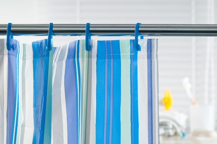 Close-up of a blue striped shower curtain