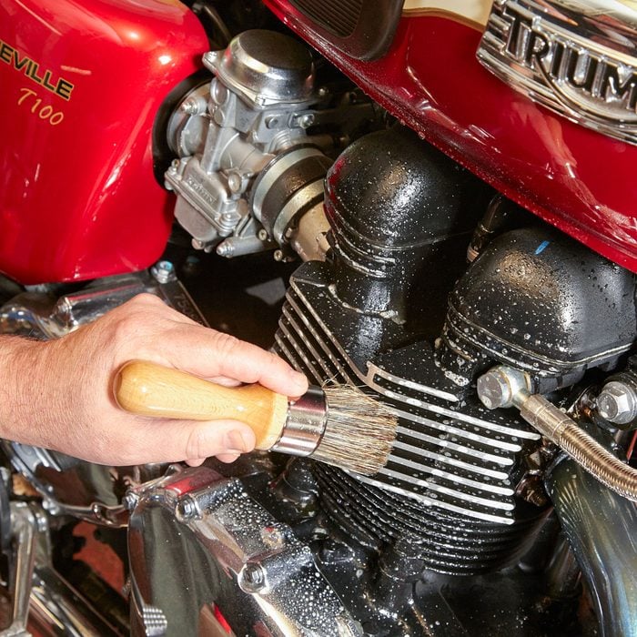 Cleaning Motorcycle Engine with Detailing Brush