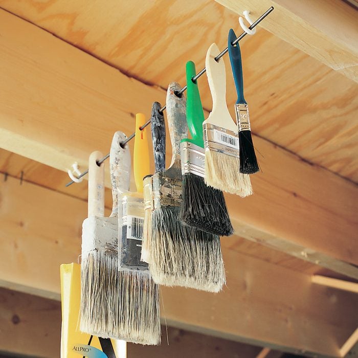 Paint Brushes Hanged on a thin Rod