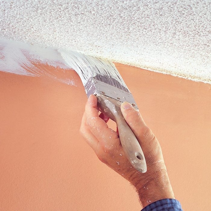Painting Ceiling Edge With Brush