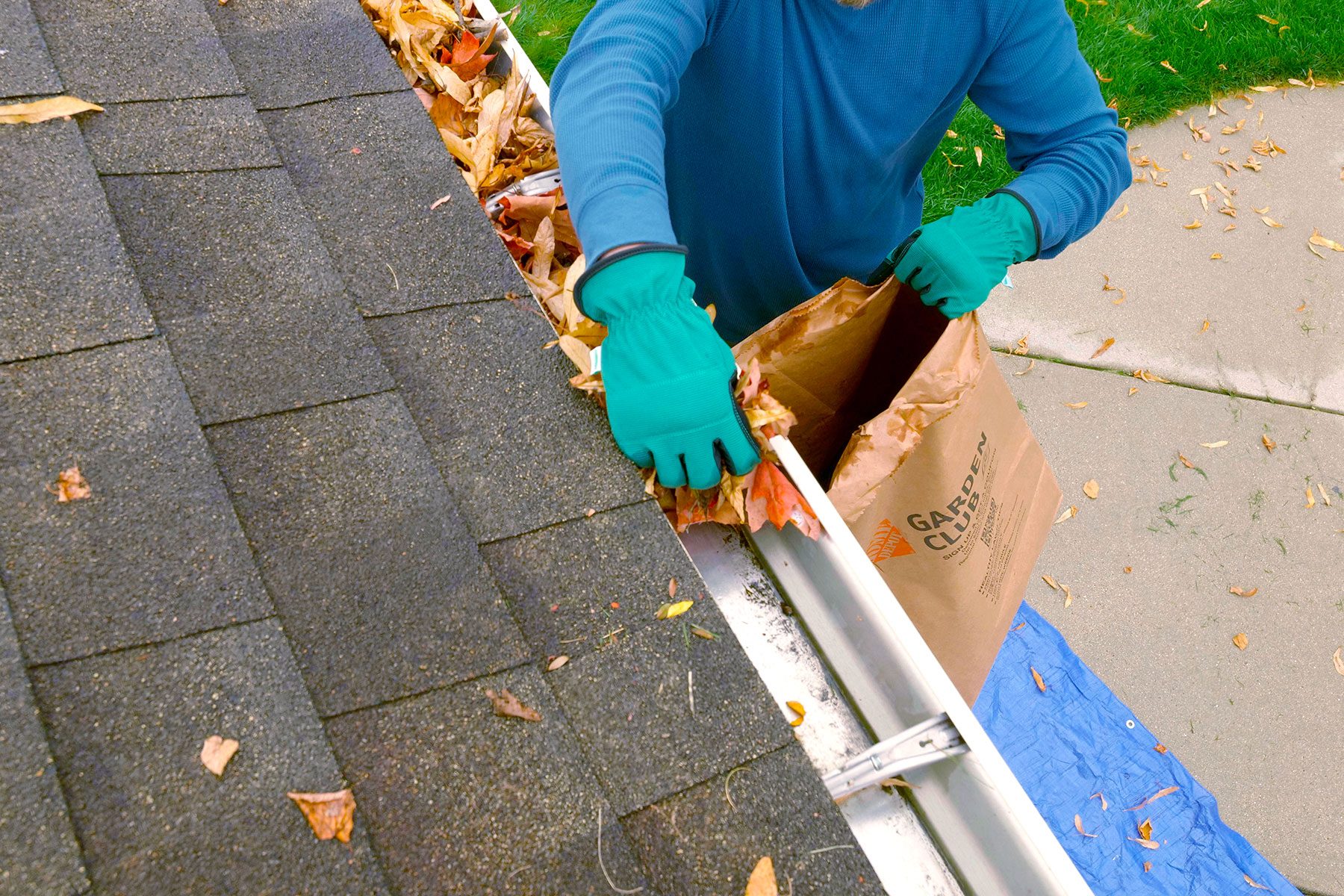 Cleaning gutters with hand 