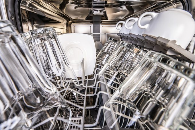 Upper Portion of Dishwasher with clean shiny cups