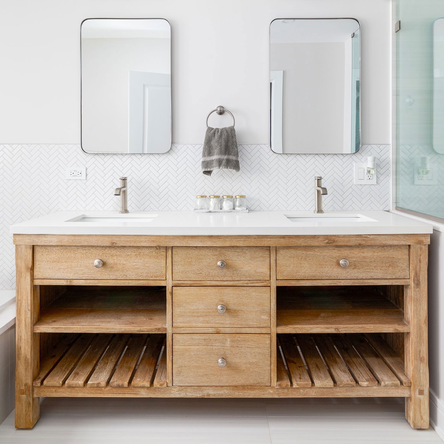 A Cozy Bathroom With A White Oak Vanity Cabinet White Countertop