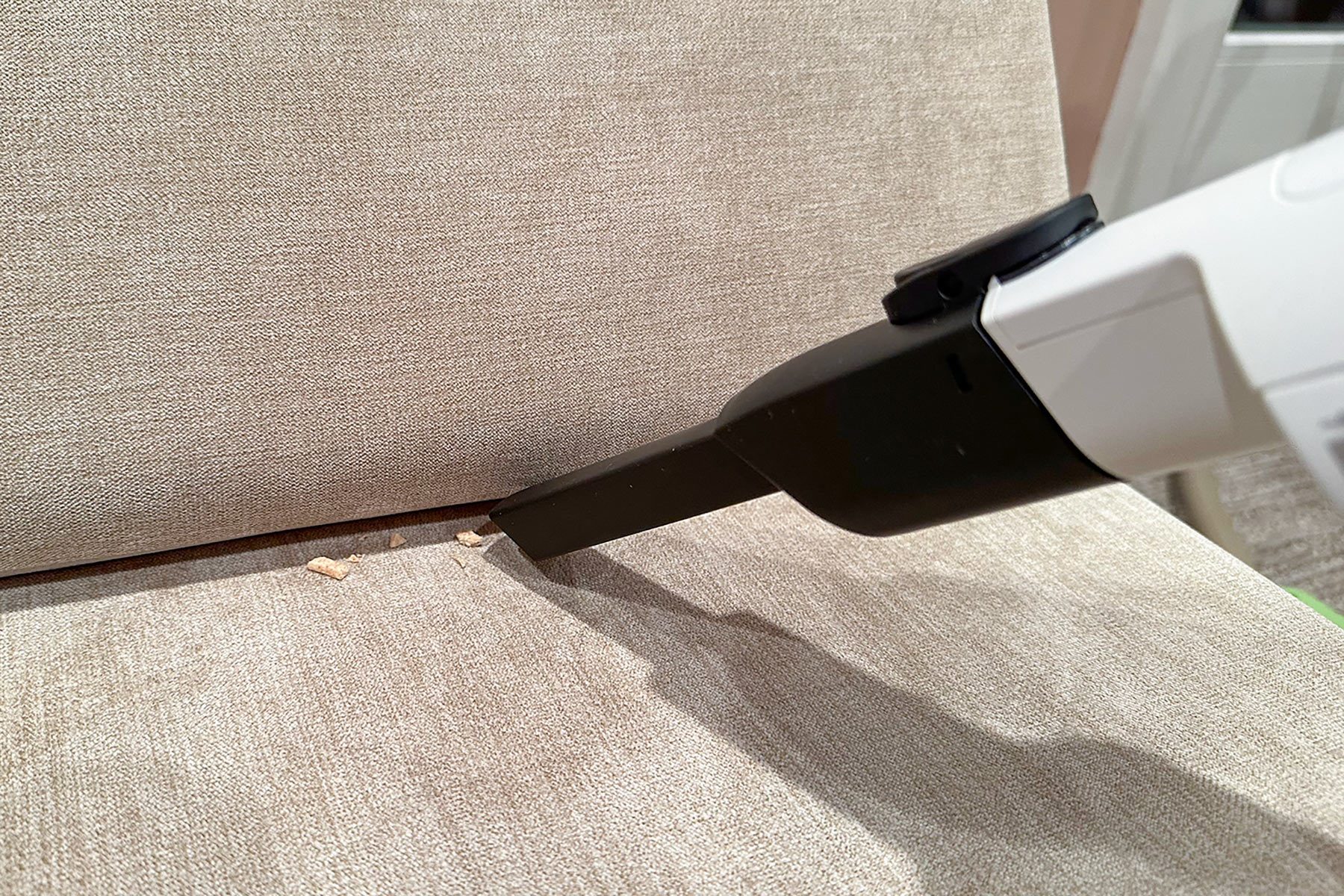  Shark Cordless Pro Vacuum used for cleaning couch