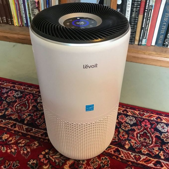 view of the screen on the Levoit 400s Air Purifier sitting on the floor of a home library