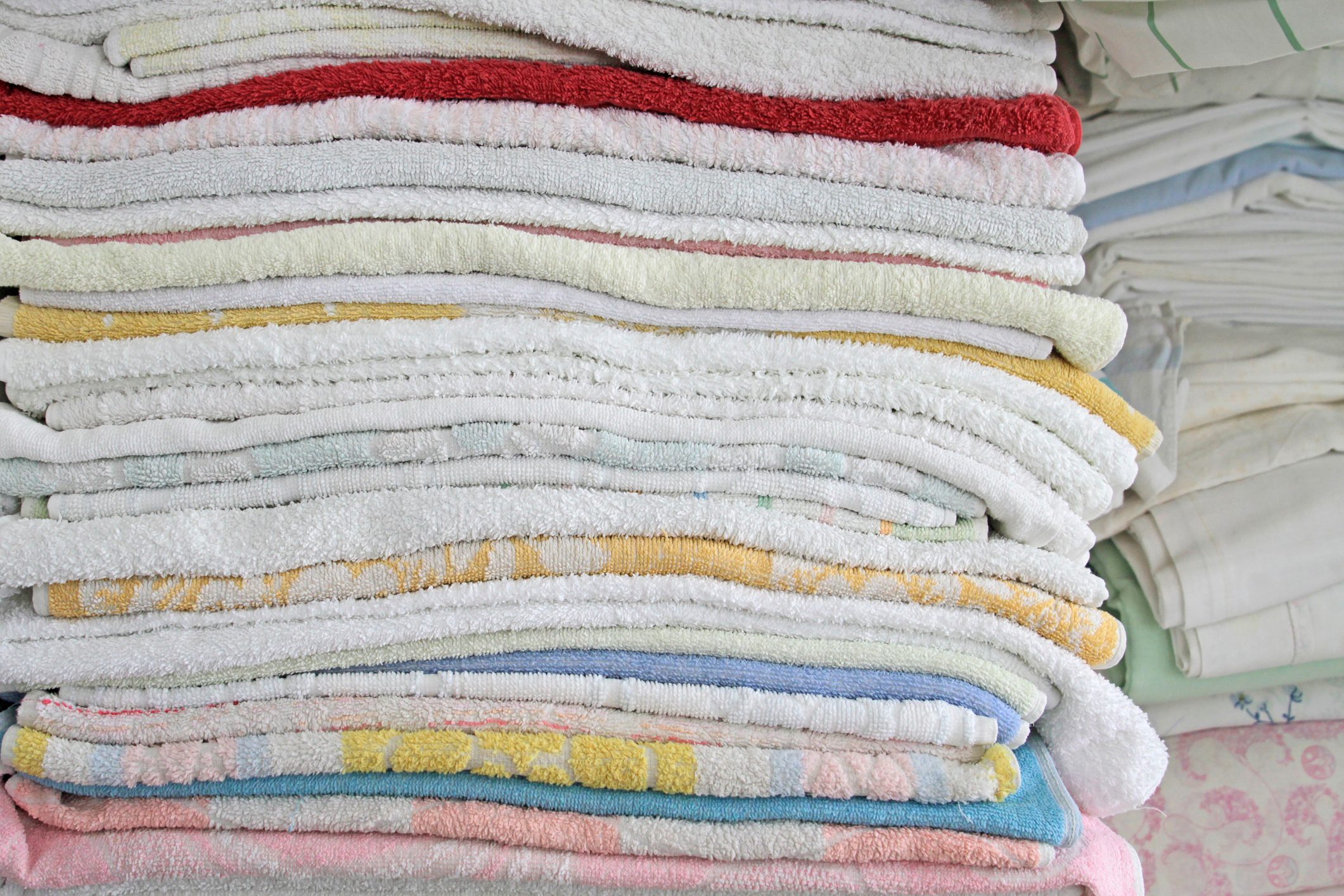 Close-Up Of Stacked Towels In Closet