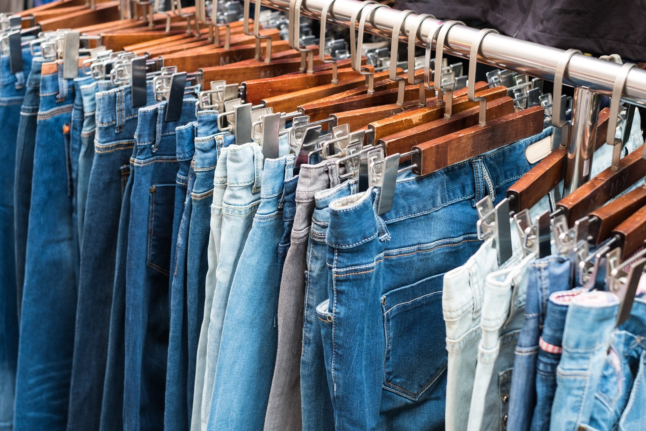 jeans on hangers, second hand clothing -