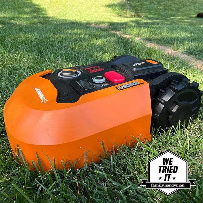 Orange Lawn Mower on grass