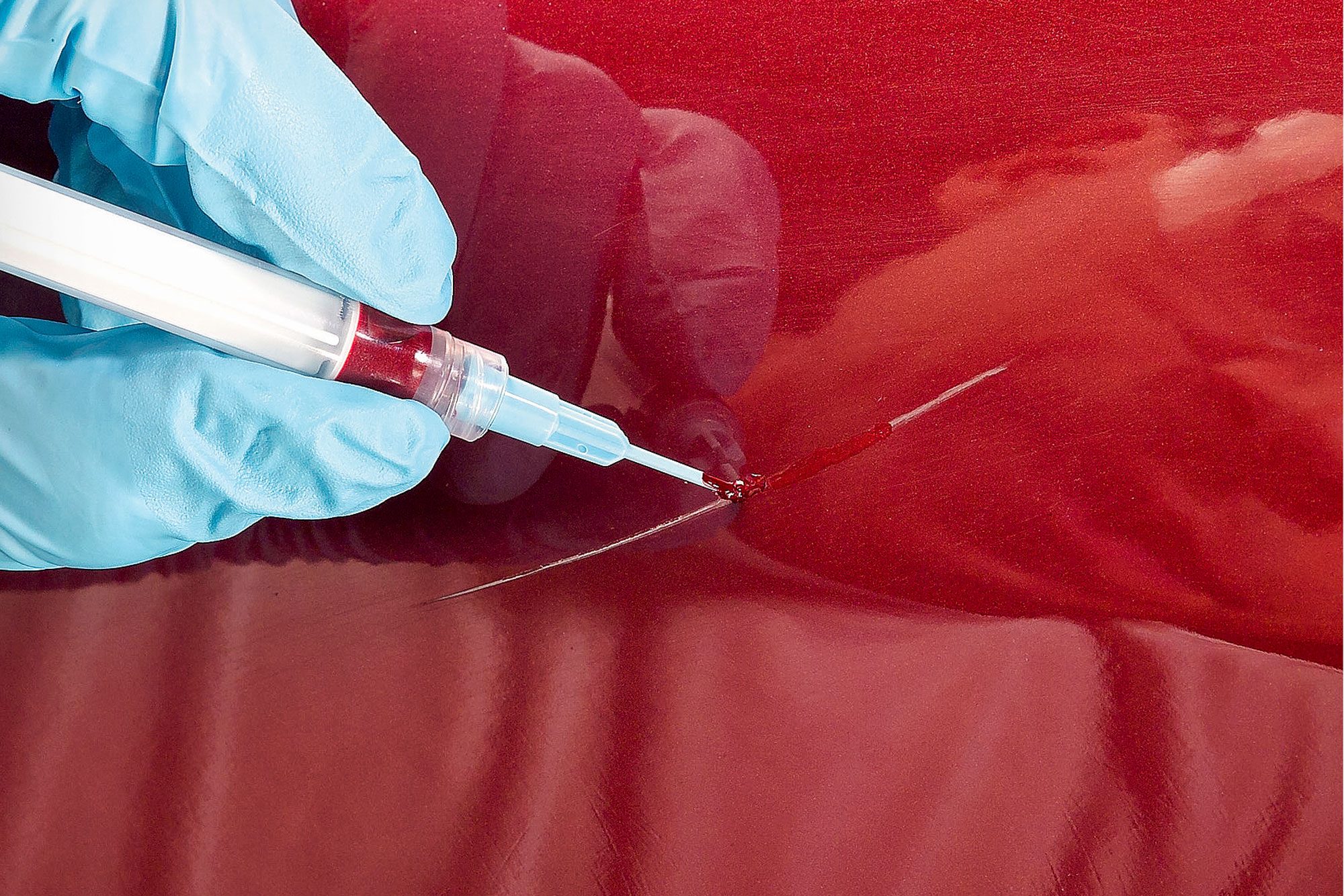 Applying Paint on Scratches with Syringe