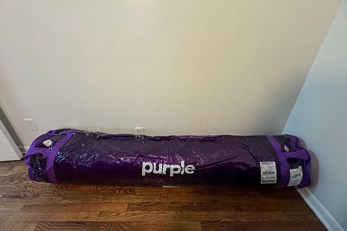  Purple Restore Cool Touch Hybrid Mattress packed up and on floor