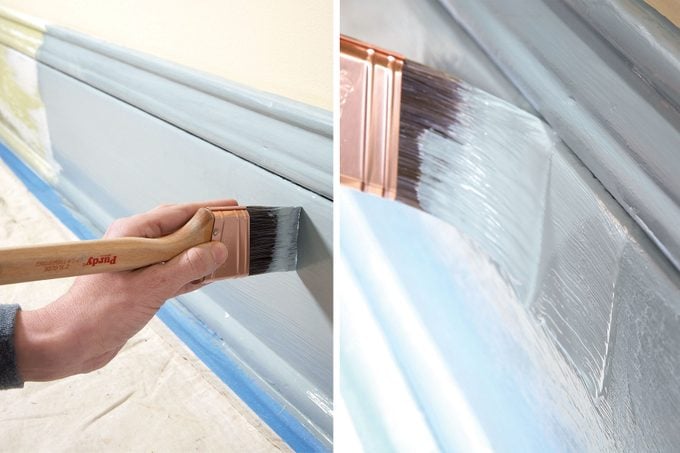 Painting a wall at home with a brush