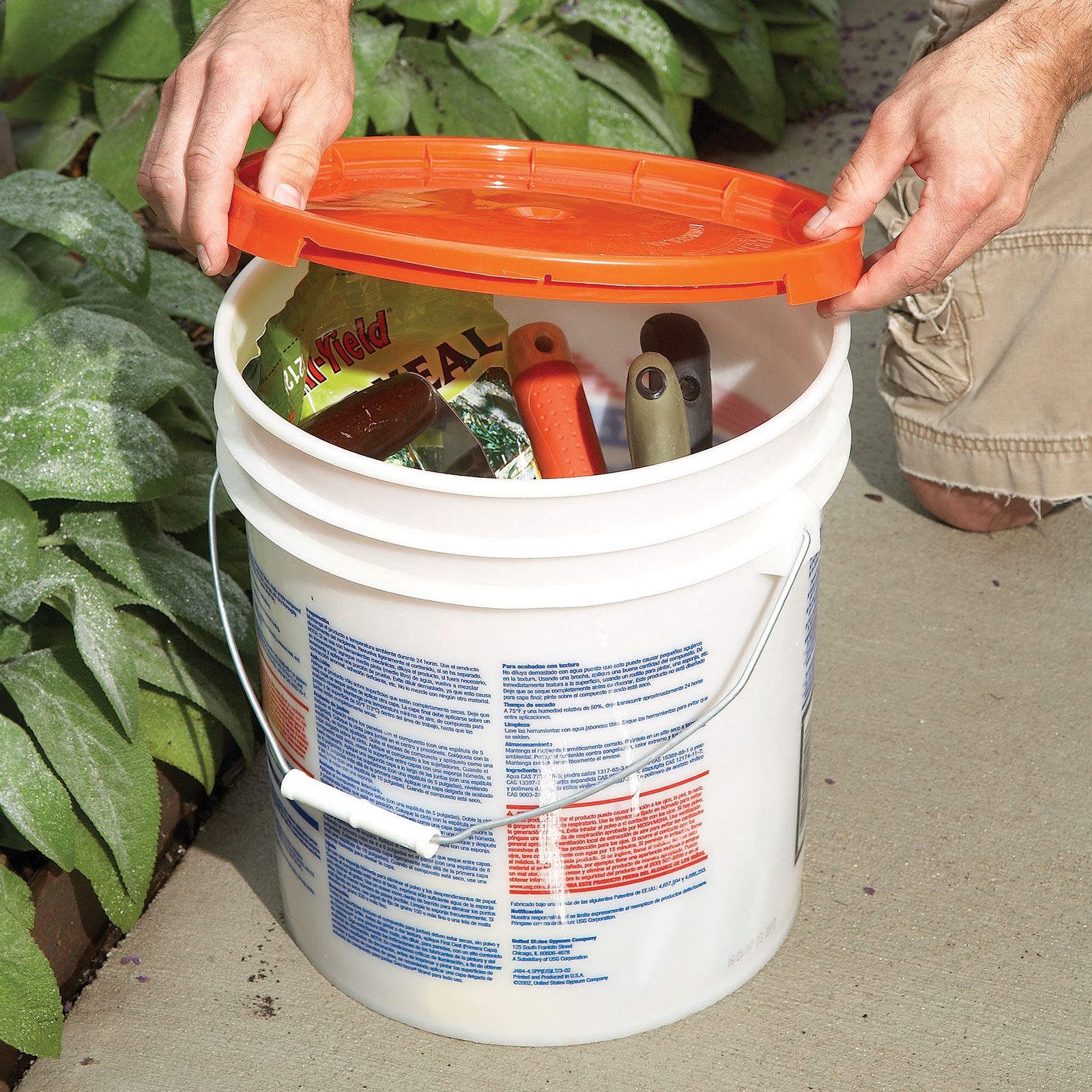 5 gallon bucket with a lid and tools inside