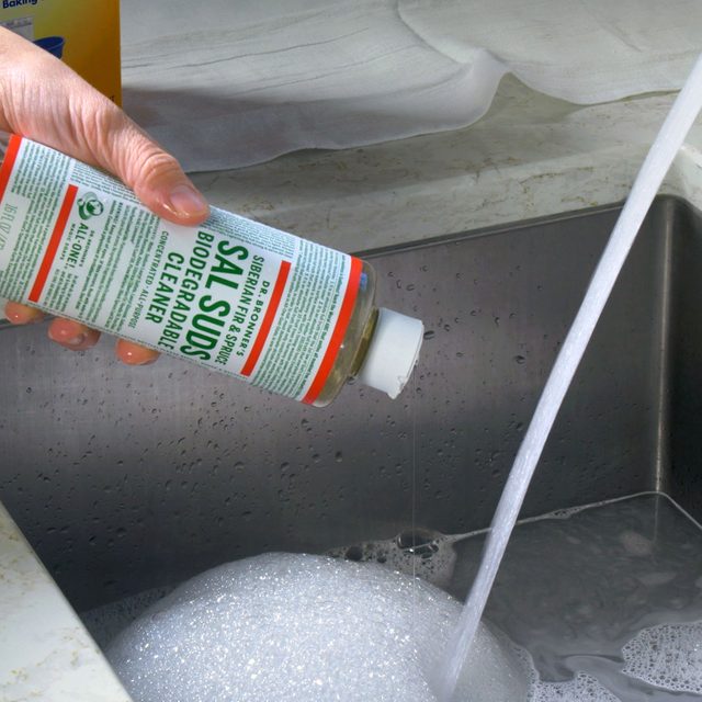 Fill sink with cleaning mix