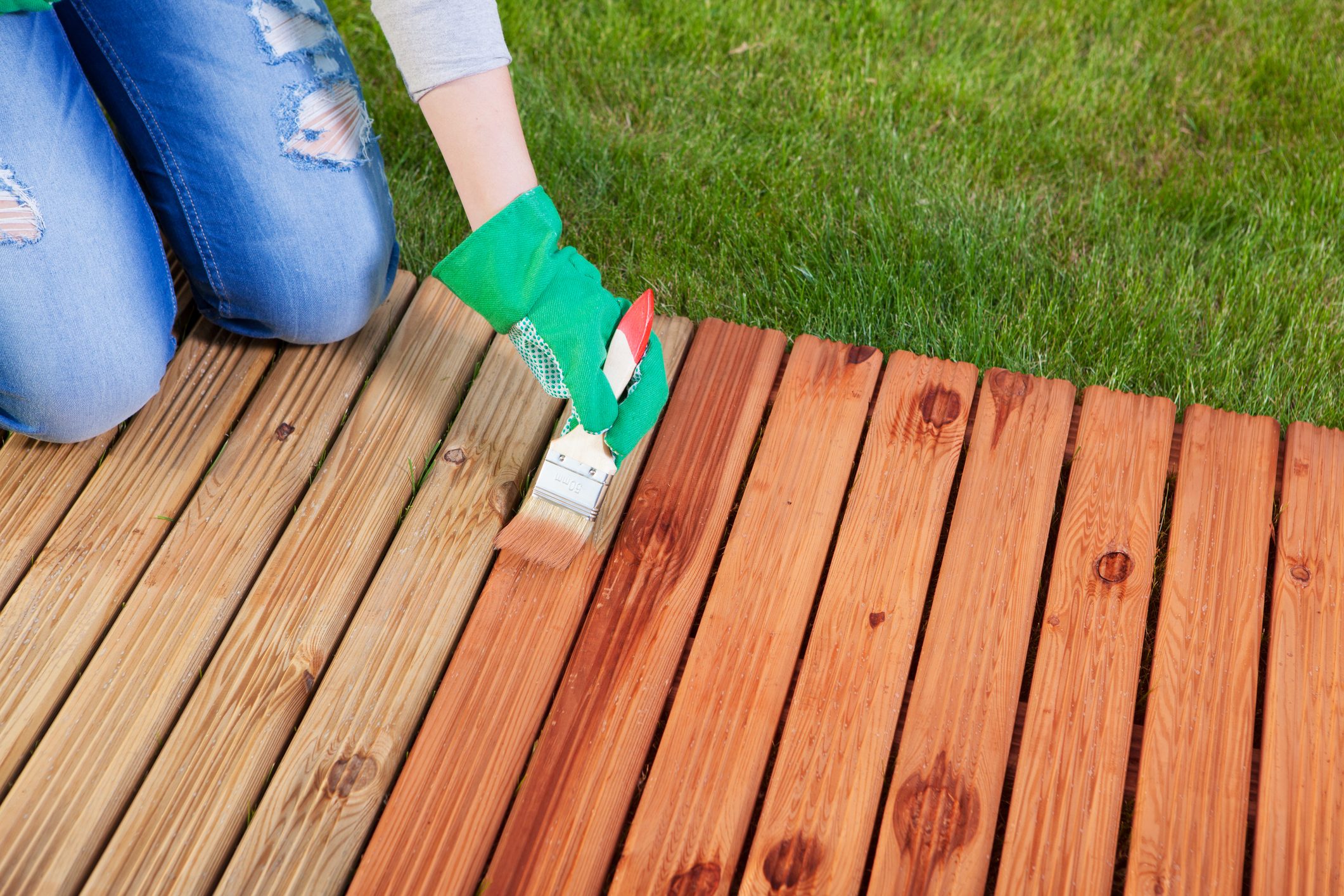 Applying protective varnish on a Deck