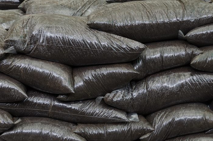 A stack of bags of Top Soil in a garden centre