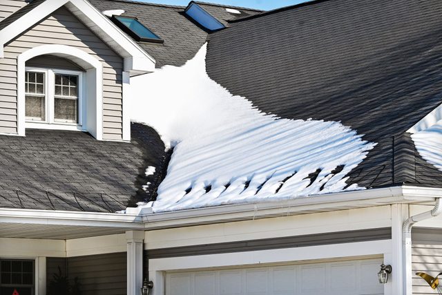 Ice On The Roof Of House