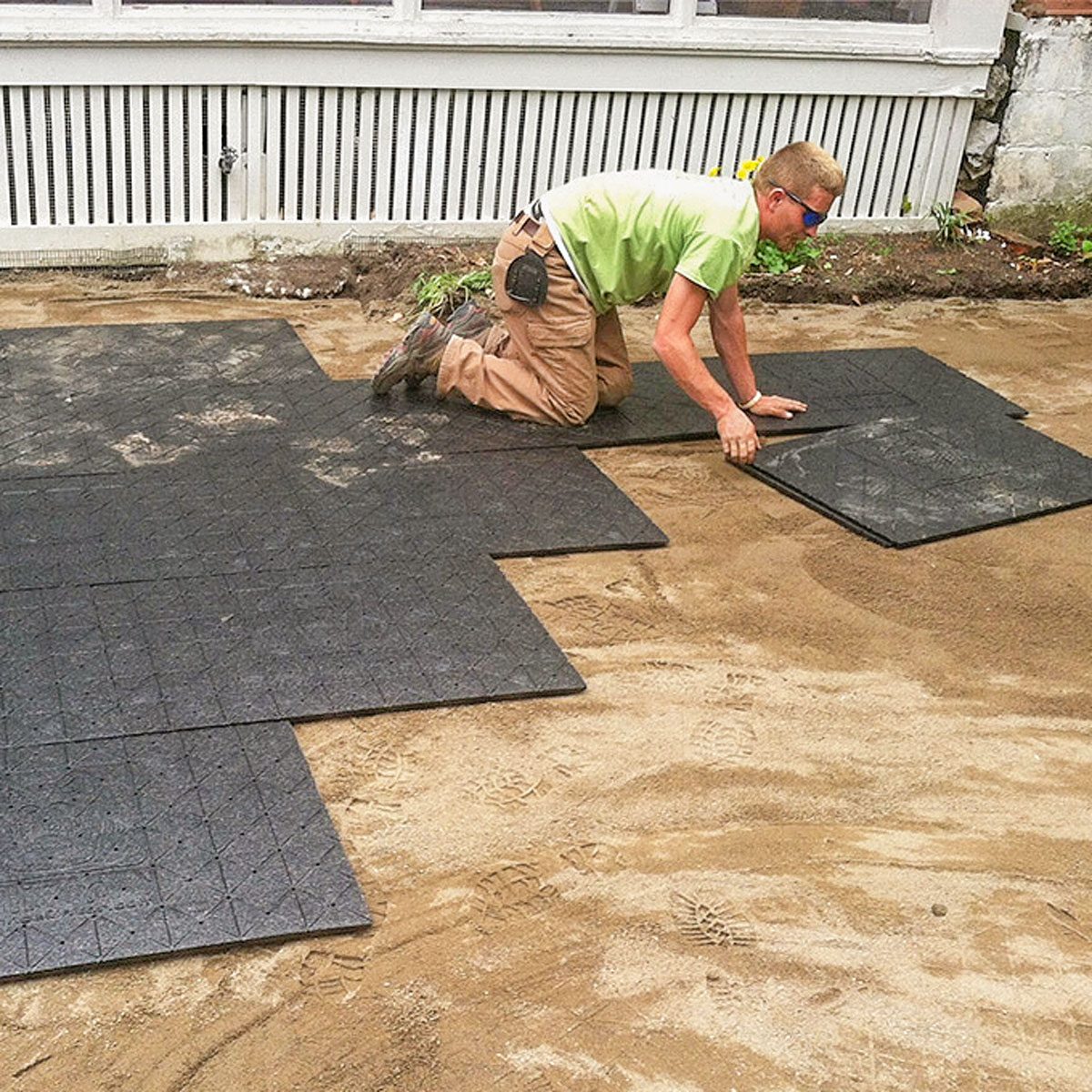 Lay Paver Mat Panels On Leveled Sand