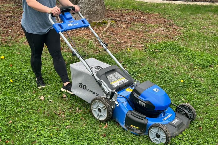 Lady Mowing the lawn with EGO Self Propelled Mower