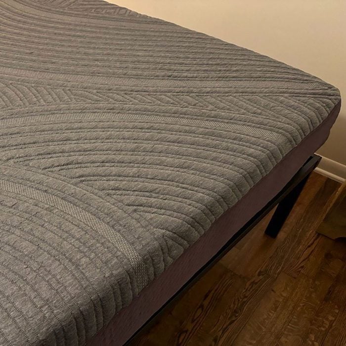 A bed with a mattress on top of it.